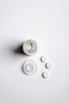 Pills and medicine over a white board
