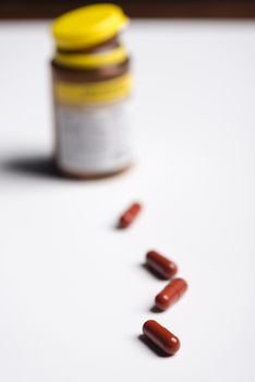 Pills and medicine over a white board