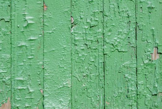 texture of wooden surface with remnants of old paint that has dried and cracked under the influence of weather