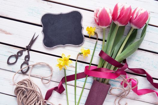 Spring tulips with small blackboard sign