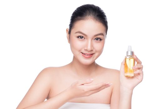 Health, spa and beauty concept. Asian woman with perfect skin holding oil bottle