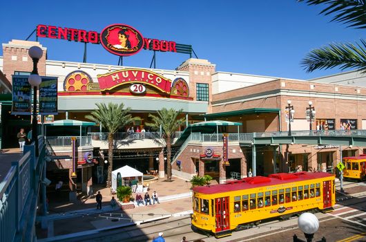 TAMPA, FLORIDA, US - November 29, 2003: Centro Ybor entrance with yellow trams and visiting tourists, Tampa, FL