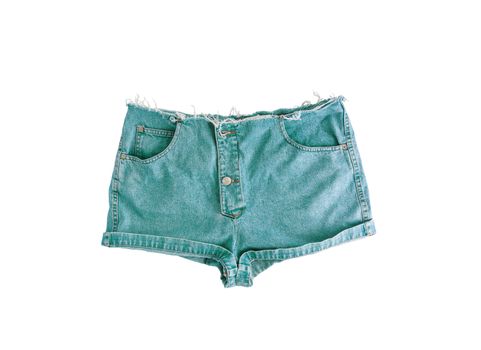 Denim short shorts with torn edge, isolated on white background.