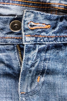 Denim pants to unfasten the zipper close-up.