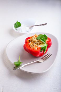 Stuffed red peppers filled with quinoa and vegetables