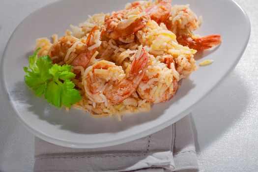 Bowl of fried rice with shrimps on a plate