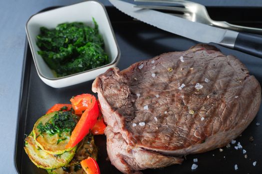 Roast Beef dinner with roasted zucchini, pepper and salsa verde