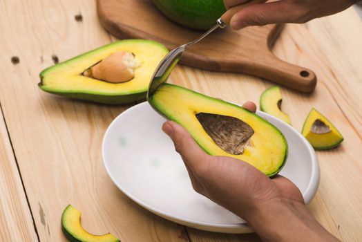 Healthy food concept. Eating fresh organic avocado