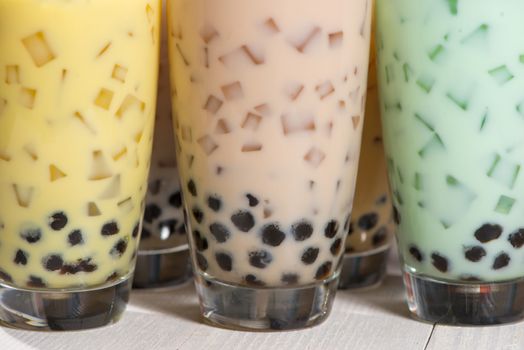 Bubble tea. Homemade Various Milk Tea with Pearls on wooden table.