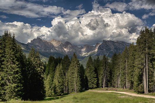 Summer landscape in the italian alps with clouds over the Odle mountains, Dolomiti - Trentino-Alto Adige