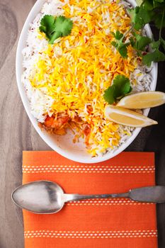 Indian Biryani with Shrimp and lemon on a table