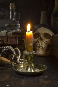 Gothic still life with a skull and a candle