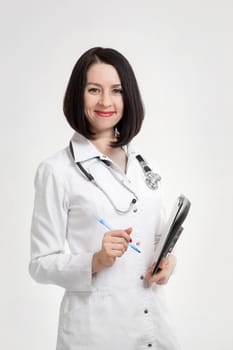 the young beautiful woman the doctor on a white background