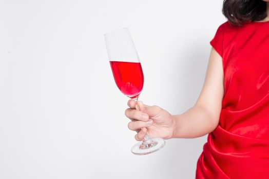 Cropped images of beautiful asian girl in evening dress smiling holding glass of champagne