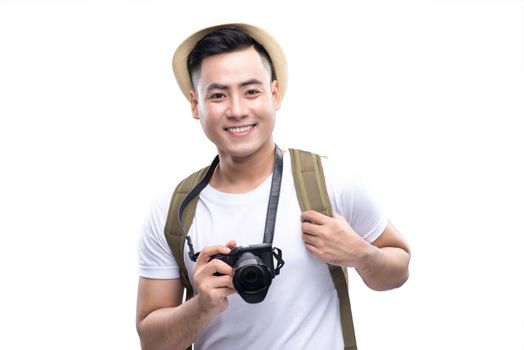 Travel concept. Studio portrait of handsome young man in hat with backpack. Isolated on white.