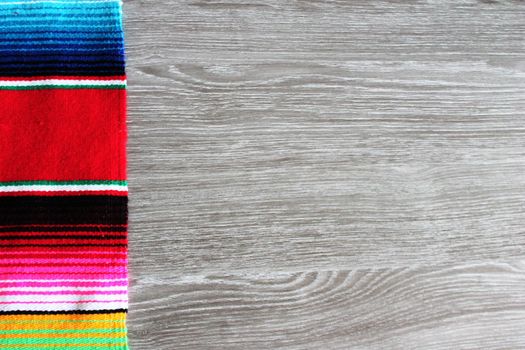 poncho serape background Mexican cinco de mayo fiesta wooden copy space