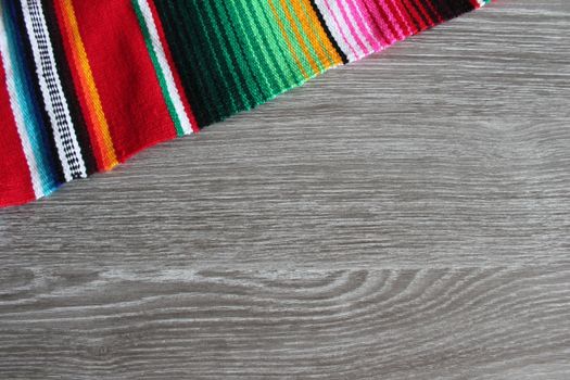 poncho serape background Mexican cinco de mayo fiesta wooden copy space