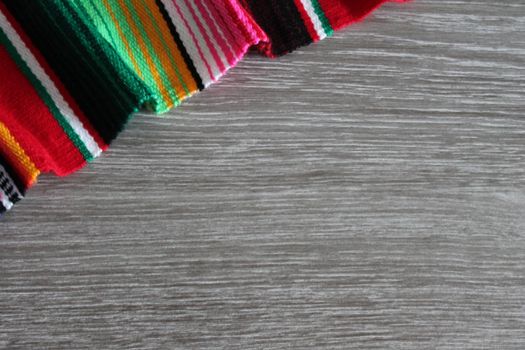 poncho serape background Mexican cinco de mayo fiesta wooden copy space