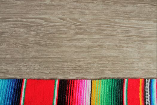 poncho serape background Mexican cinco de mayo fiesta wooden copy space