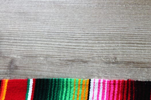 poncho serape background Mexican cinco de mayo fiesta wooden copy space