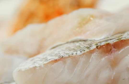 fresh cod back on showcase of seafood market.