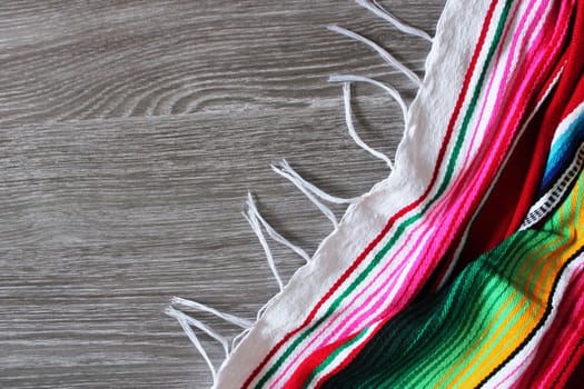 poncho serape background Mexican cinco de mayo fiesta wooden copy space