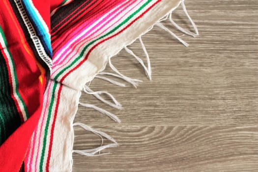 poncho serape background Mexican cinco de mayo fiesta wooden copy space