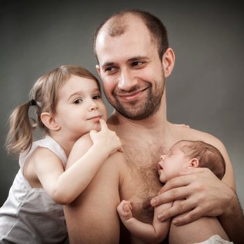 father with the daughter and newborn child