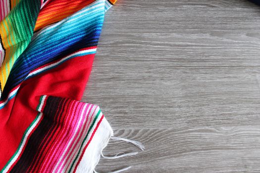 poncho serape background Mexican cinco de mayo fiesta wooden copy space