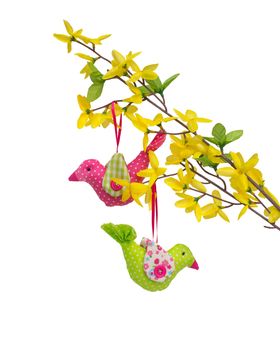 Two birds of fabric (handwork) on an artificial forsythia branch