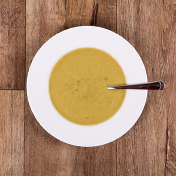 Vegetarian vegetable soup on a wooden table