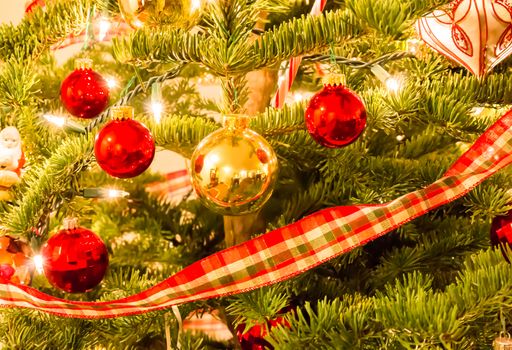 Beautiful Christmas Ornaments Hanging on a Pine Tree
