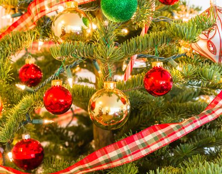 Beautiful Christmas Ornaments Hanging on a Pine Tree