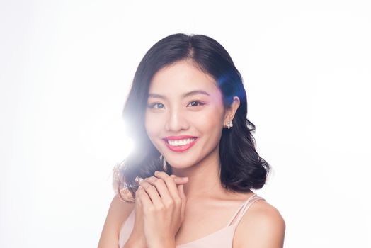 Glamour portrait of beautiful ASIAN woman model with nice makeup and romantic wavy hairstyle.