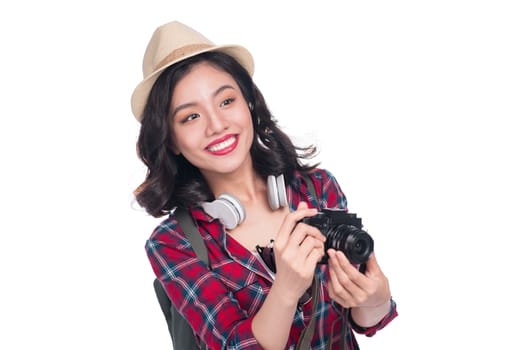 Woman travel. Young beautiful asian woman traveler taking pictures on white background
