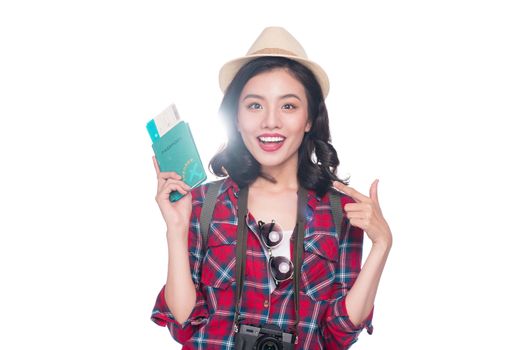 Woman travel. Young beautiful asian woman traveler holding passport and air ticket standing over white.
