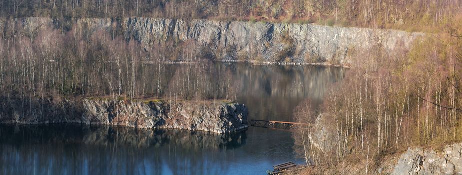 Panoramic view of an old open opencast mine of limestone works in Wuelfrath, Germany on a winter day.