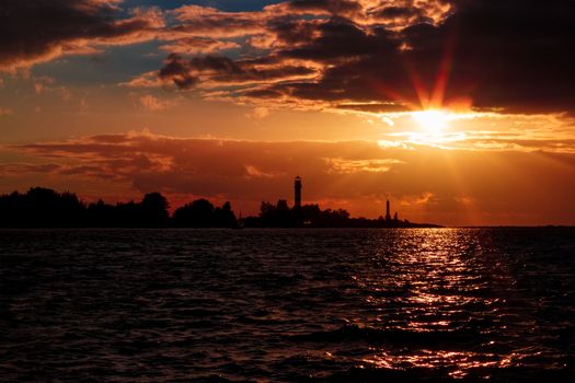 Golden sunset sky over the town silhouette