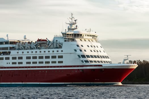 Red cruise liner's bow. Passenger ferry underway