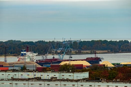 Cargo ship loading with a coal in port at Riga city, Latvia