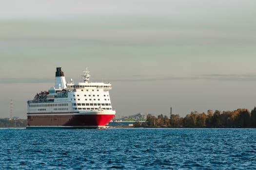 Red cruise liner. Passenger ferry sailing from Riga to Stockholm