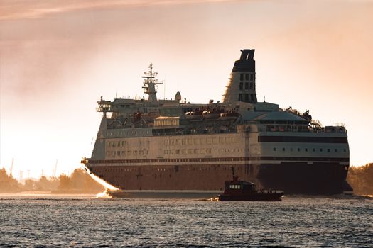 Big cruise liner. Passenger ferry ship entering Riga at morning