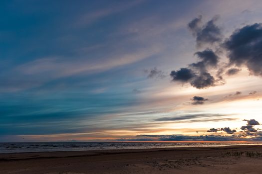 Blue cloudy sky over the Baltic sea at evening