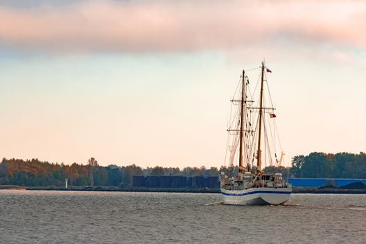 White sailing ship coming from Baltic sea and entering Riga