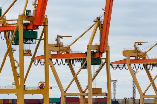 Yellow cargo cranes in the port of Riga, Europe