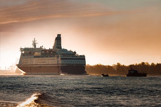 Big cruise liner. Passenger ferry ship entering Riga at morning