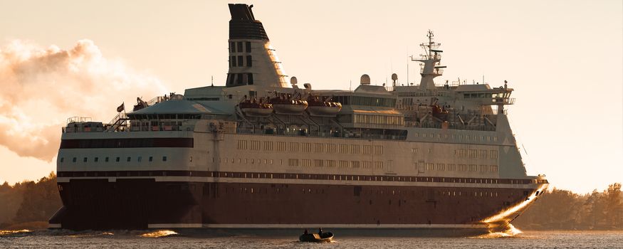 Big cruise liner. Passenger ferry ship entering Riga at morning