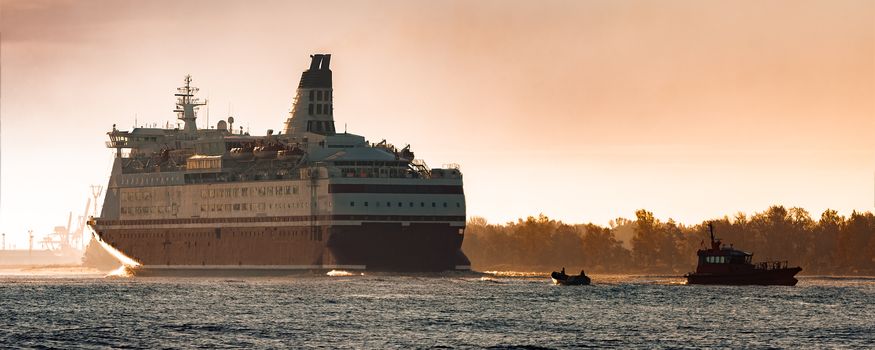 Big cruise liner. Passenger ferry ship entering Riga at morning