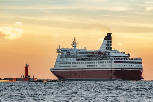 Red cruise liner. Passenger ferry sailing from Riga to Stockholm