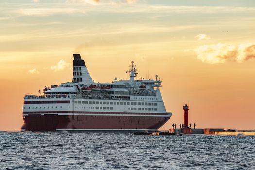 Red cruise liner. Passenger ferry sailing from Riga to Stockholm